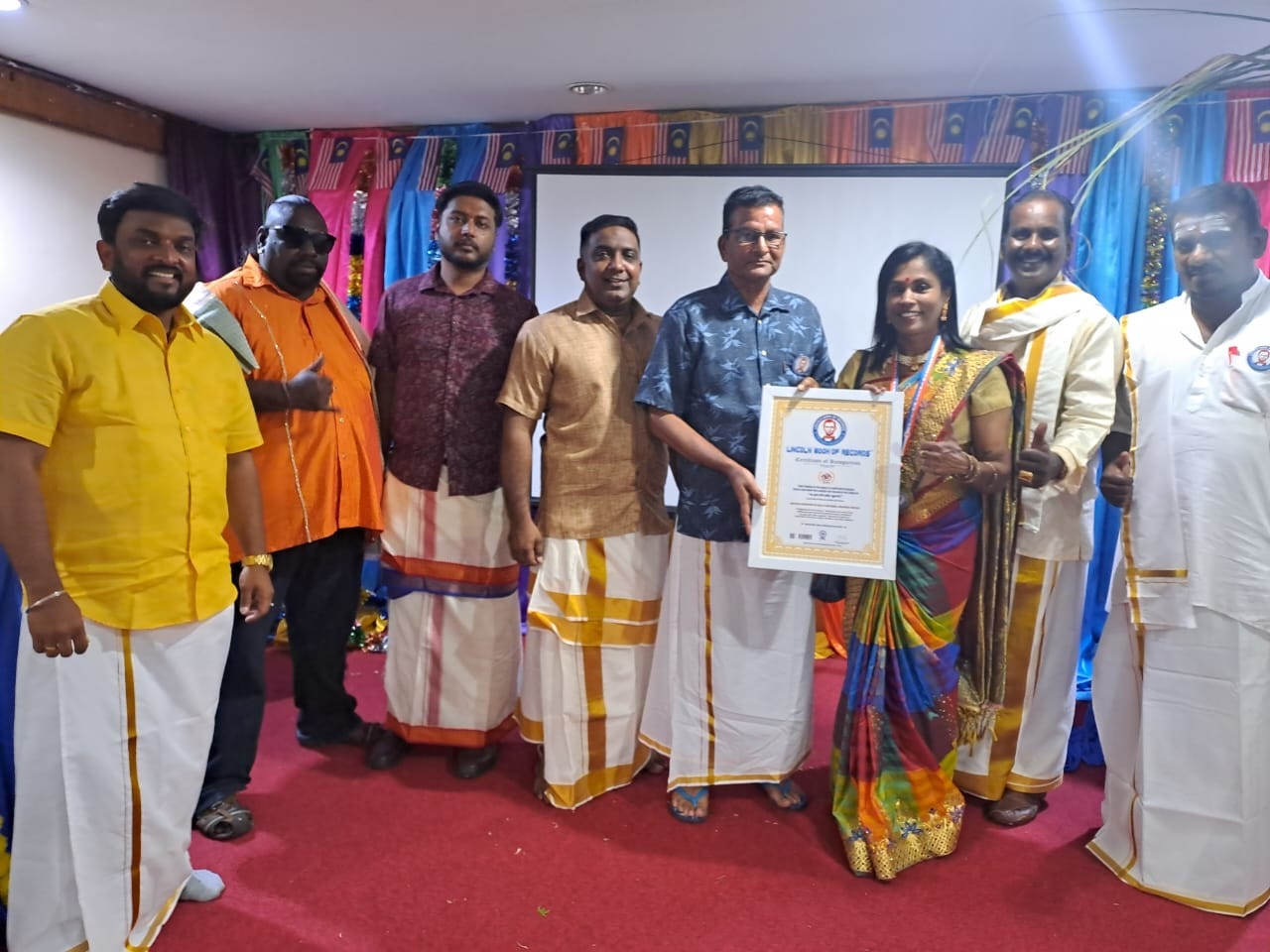 "First woman in the world to unite multilingual  people and draw the largest dot kolam in the theme of  " தை முதல் நாளே தமிழ்ப் புத்தாண்டு".